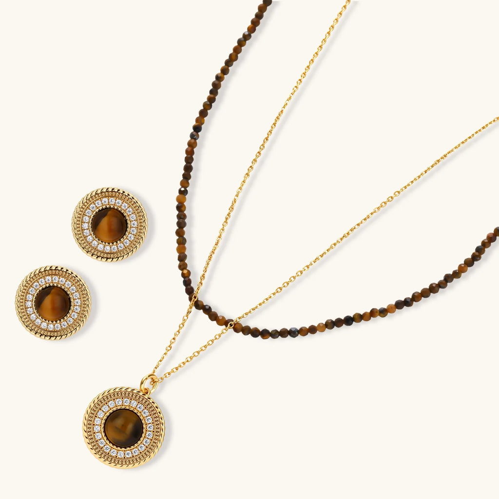 Gold-plated circular pendant necklace and matching earrings with natural stone centers and ornate rope detailing