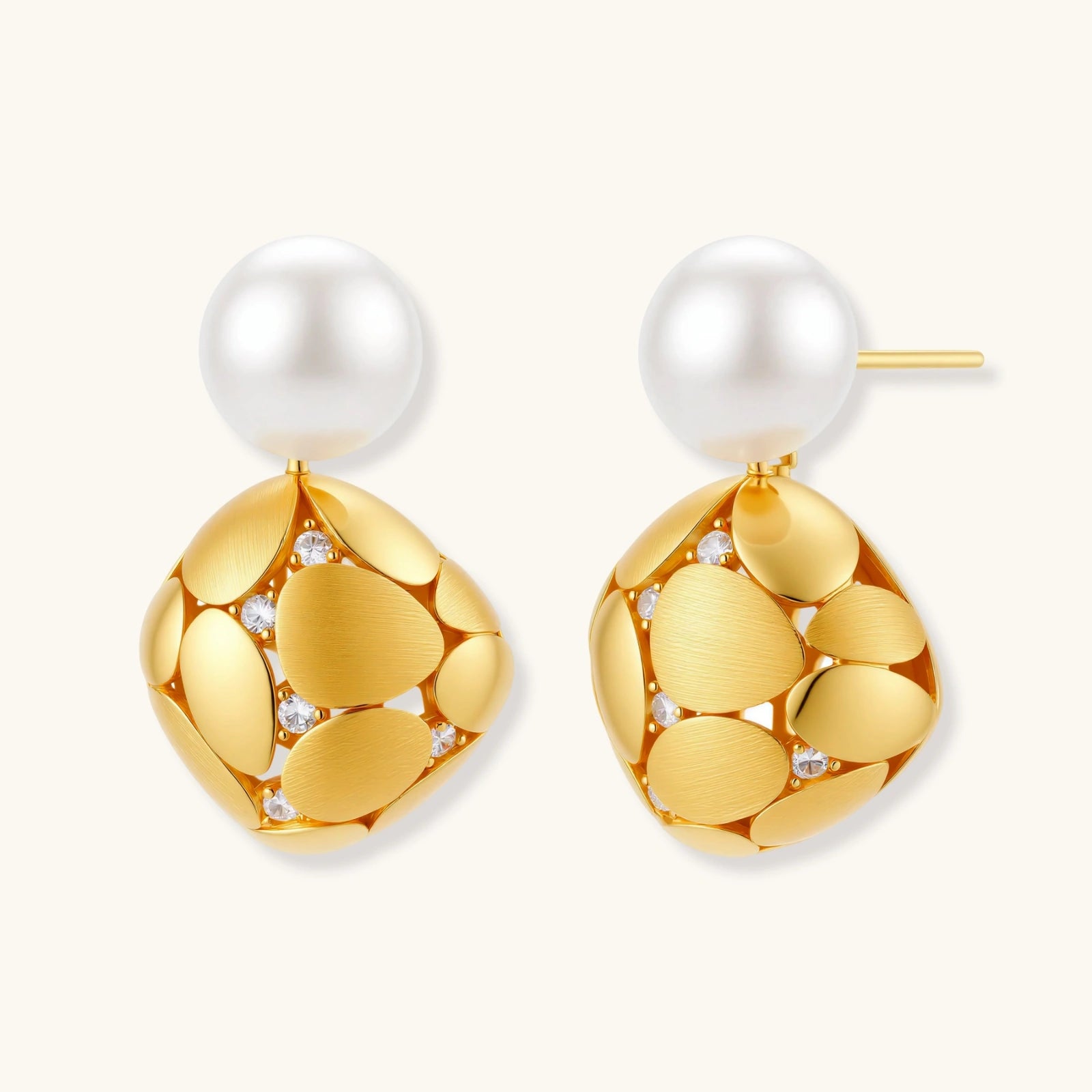 Gold-plated sterling silver drop earrings with white freshwater pearl studs and overlapping petal design with crystal accents
