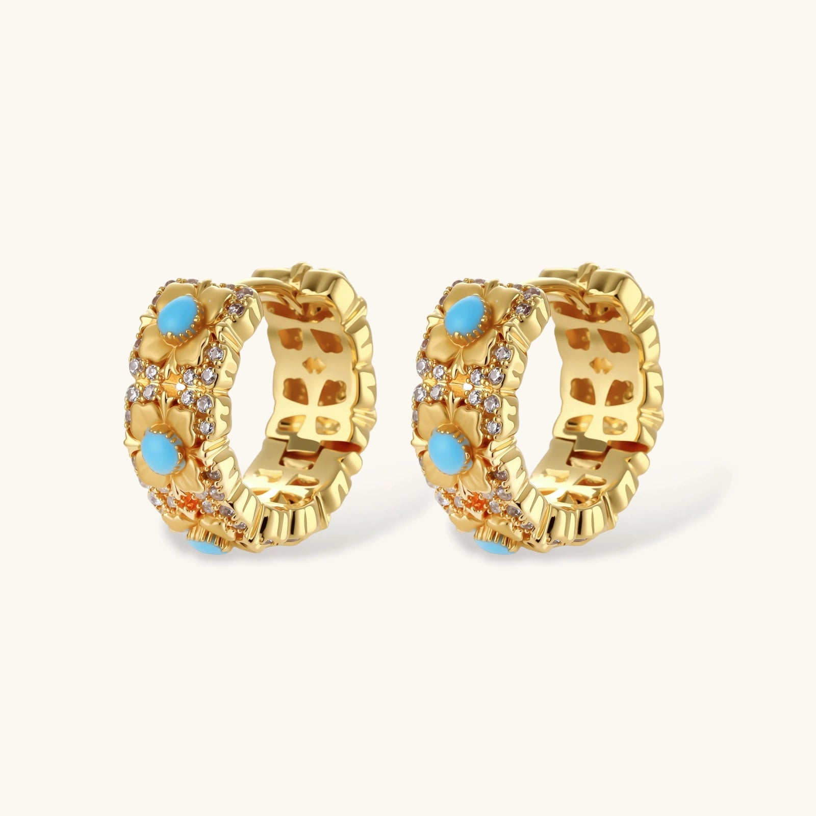 18K gold-plated hoop earrings with turquoise-centered flowers and crystal details on white background.