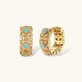 18K gold-plated hoop earrings with turquoise-centered flowers and crystal details on white background.