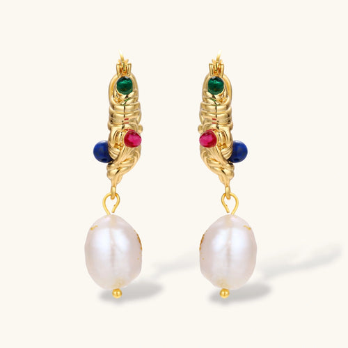 Ornate gold-plated hoop earrings with emerald, ruby, and sapphire accents, featuring dangling baroque freshwater pearls