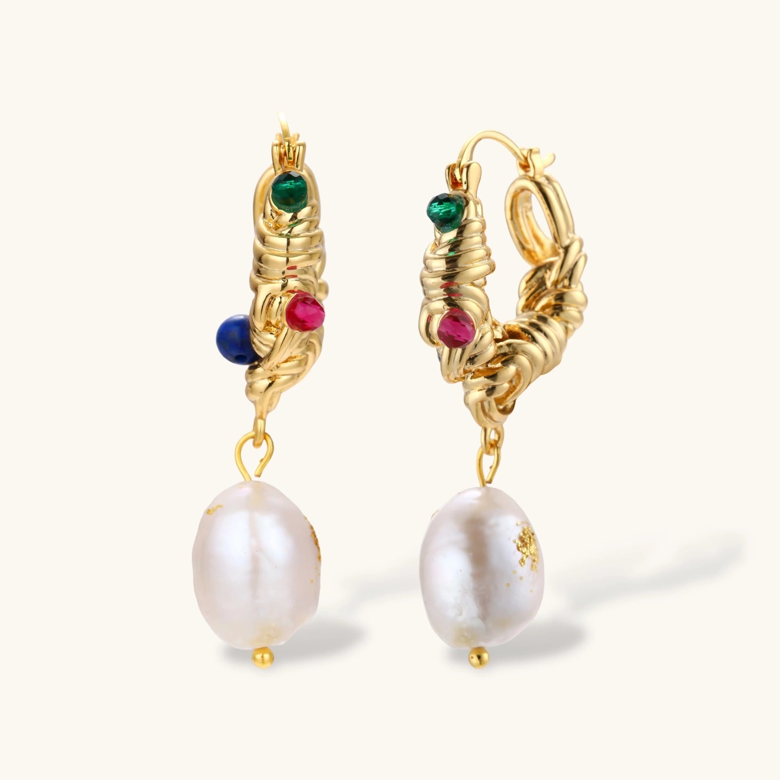 Ornate gold-plated hoop earrings with emerald, ruby, and sapphire accents, featuring dangling baroque freshwater pearls