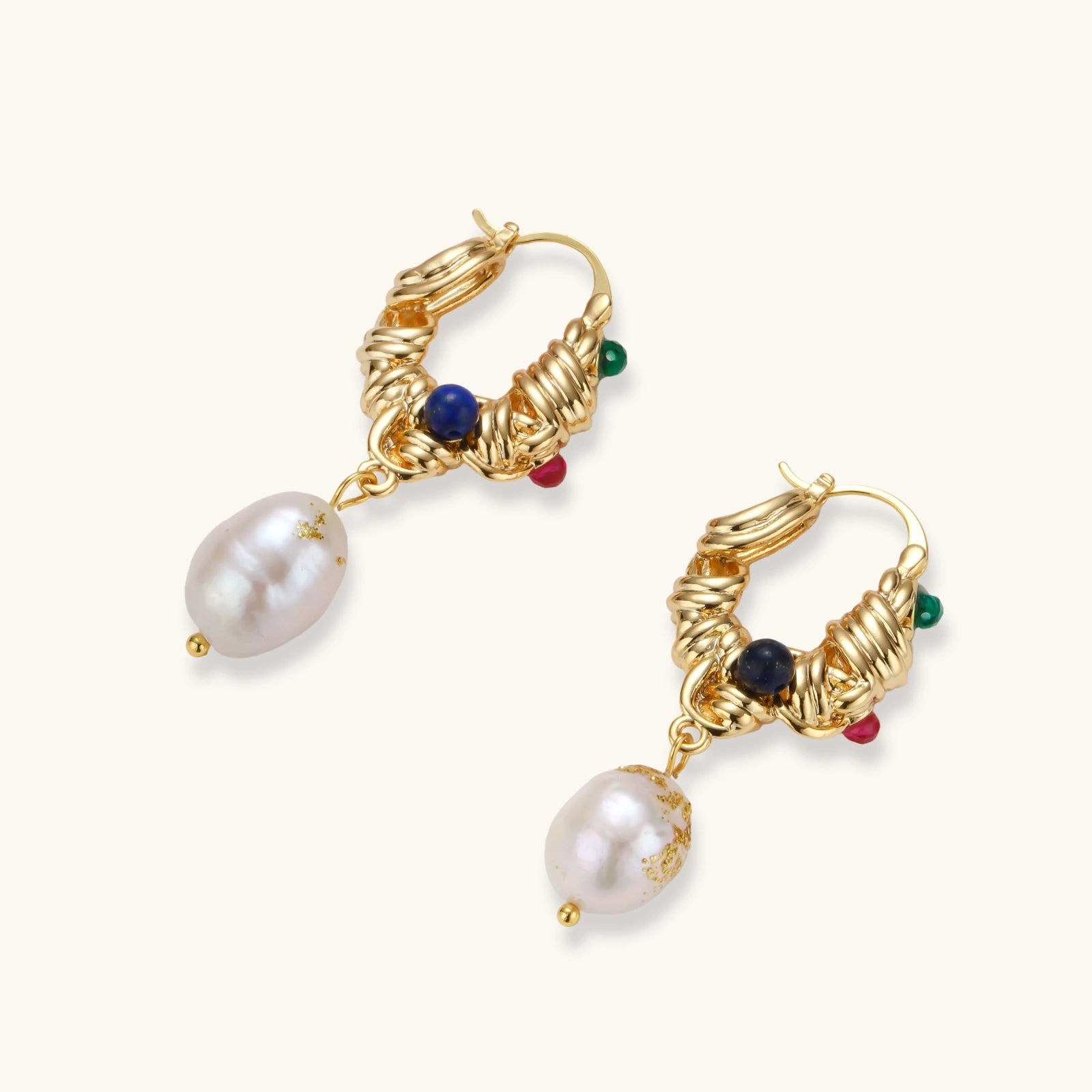 Ornate gold-plated hoop earrings with emerald, ruby, and sapphire accents, featuring dangling baroque freshwater pearls