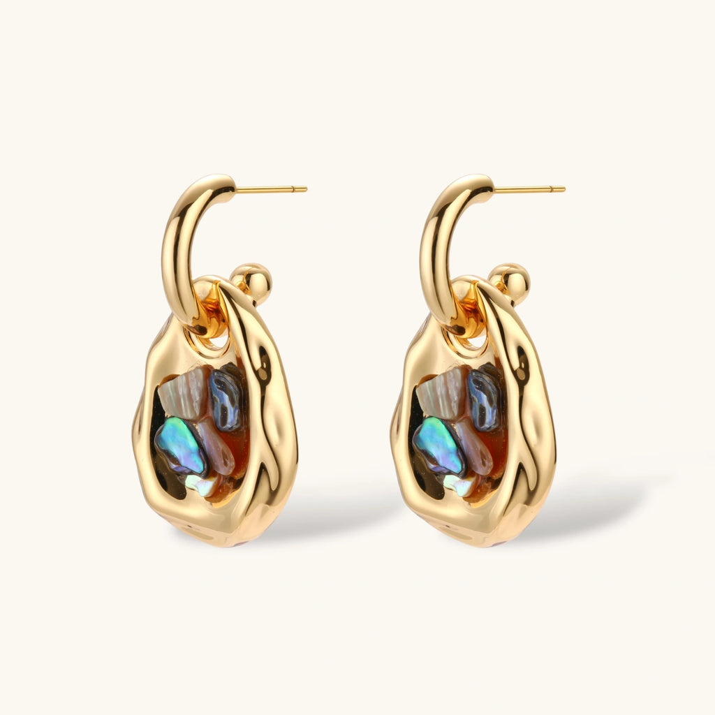 Gold-plated convertible hoop earrings with iridescent shell mosaic pendants, shown assembled and separated on cream background.